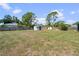 Spacious backyard features a shed, providing ample storage and outdoor space at 1041 S Salford Blvd, North Port, FL 34287