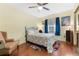 Cozy bedroom features a comfortable bed and a ceiling fan for added comfort at 1041 S Salford Blvd, North Port, FL 34287