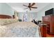 Spacious bedroom with soft lighting, comfortable bed, and ample closet space at 1041 S Salford Blvd, North Port, FL 34287