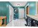 Warm entryway featuring tile flooring and classic decor elements at 1041 S Salford Blvd, North Port, FL 34287