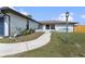 Charming single-story home with well-maintained lawn and front walkway at 1041 S Salford Blvd, North Port, FL 34287