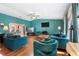 Spacious living room featuring hardwood floors and comfortable seating arrangements at 1041 S Salford Blvd, North Port, FL 34287