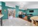 Open-concept living spaces showcasing tile and hardwood flooring at 1041 S Salford Blvd, North Port, FL 34287
