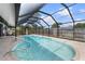 Sparkling screened-in pool offers a refreshing escape in a private backyard setting at 1041 S Salford Blvd, North Port, FL 34287