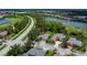 Property aerial view showcasing landscaping and proximity to golf course and community at 1062 Eagles Flight Way, North Port, FL 34287