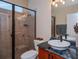 Bathroom with walk in shower and modern vanity at 1062 Eagles Flight Way, North Port, FL 34287