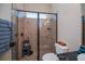 Well-lit bathroom featuring tiled shower with glass door and shower head at 1062 Eagles Flight Way, North Port, FL 34287