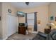 Bedroom featuring wood floors, neutral walls, a small desk, and a comfortable armchair at 1062 Eagles Flight Way, North Port, FL 34287