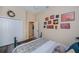 Inviting bedroom with a ceiling fan, closet and decorative wall art at 1062 Eagles Flight Way, North Port, FL 34287