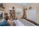 Comfortable bedroom featuring a ceiling fan, built-in shelving, natural light, and a closet at 1062 Eagles Flight Way, North Port, FL 34287