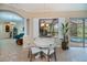 Cozy breakfast nook with a large window view of the pool and access to open-concept living at 1062 Eagles Flight Way, North Port, FL 34287