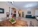 Open concept view of the dining area, and living room with an arched doorway to the foyer at 1062 Eagles Flight Way, North Port, FL 34287