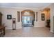 Spacious foyer with tiled floor, archways, and pillars leading to other living areas, creating an open and inviting space at 1062 Eagles Flight Way, North Port, FL 34287