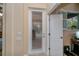 Hallway showing open door and the pool area through a door with built-in blinds at 1062 Eagles Flight Way, North Port, FL 34287