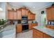Well-equipped kitchen with stainless steel appliances, granite countertops, and ample cabinet space at 1062 Eagles Flight Way, North Port, FL 34287