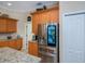 Modern kitchen featuring stainless steel appliances, updated cabinetry, and ample counter space at 1062 Eagles Flight Way, North Port, FL 34287