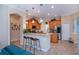 Modern kitchen featuring granite countertops, stainless steel appliances, a breakfast bar, and ample cabinetry at 1062 Eagles Flight Way, North Port, FL 34287