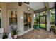 Covered lanai area with view of a lush, green backyard at 1062 Eagles Flight Way, North Port, FL 34287