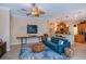 Open-concept living area featuring modern furnishings and seamless flow to the kitchen and dining area at 1062 Eagles Flight Way, North Port, FL 34287