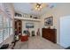 Comfortable living room showcasing a guitar collection and custom built-ins at 1062 Eagles Flight Way, North Port, FL 34287