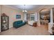 Cozy living room with comfortable seating, large windows, and an open layout at 1062 Eagles Flight Way, North Port, FL 34287