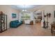 Bright and airy living room featuring tile flooring, neutral walls, and ample space for seating, great for entertaining at 1062 Eagles Flight Way, North Port, FL 34287