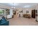 Spacious open floor plan featuring tile floors, neutral colors, and ample natural light at 1062 Eagles Flight Way, North Port, FL 34287