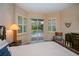 Bedroom boasts a ceiling fan, carpeted floors, and a private access to the screened-in lanai at 1062 Eagles Flight Way, North Port, FL 34287