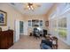 Bright office space with a desk, office chair, and plenty of natural light at 1062 Eagles Flight Way, North Port, FL 34287