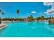 Resort-style community pool with comfortable lounge chairs and a waterfall feature at 1062 Eagles Flight Way, North Port, FL 34287