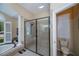 The bathroom features a tiled shower with a rainfall shower head at 1062 Eagles Flight Way, North Port, FL 34287