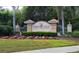 Community sign for Heron Creek Golf & Country Club with manicured landscaping at 1062 Eagles Flight Way, North Port, FL 34287