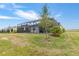 Home backyard features a screened-in lanai, beautiful landscaping, and ample space for outdoor activities at 11088 Pinot Dr, Venice, FL 34293