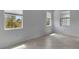 Bright bedroom with large windows, tile floors, and neutral paint, offering a serene atmosphere at 11088 Pinot Dr, Venice, FL 34293