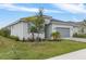 A single-story home displays a manicured lawn, stone driveway, and well-maintained landscaping at 11088 Pinot Dr, Venice, FL 34293