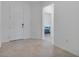 Clean, bright foyer featuring tile flooring, white walls, and access to several rooms at 11088 Pinot Dr, Venice, FL 34293
