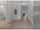 Bright foyer features tile floors, neutral walls, and an entryway view into other living spaces at 11088 Pinot Dr, Venice, FL 34293