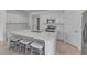 Bright kitchen with a large island, stainless steel appliances, and white cabinetry for a clean, modern look at 11088 Pinot Dr, Venice, FL 34293