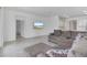 Inviting living room with sectional sofa, TV, and an open layout, perfect for entertaining at 11088 Pinot Dr, Venice, FL 34293