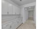 Spacious pantry area with white cabinets and light countertop, offering ample storage at 11088 Pinot Dr, Venice, FL 34293