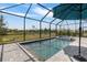 Inviting screened pool and spa surrounded by brick pavers and lush landscaping for outdoor enjoyment at 11088 Pinot Dr, Venice, FL 34293