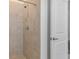 Tiled shower space featuring modern tile and a shower head, with door to bedroom at 11088 Pinot Dr, Venice, FL 34293