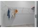 A basic walk-in closet with wire shelving installed, ready for storage solutions at 11088 Pinot Dr, Venice, FL 34293