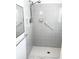 Modern shower with gray tiled walls and updated fixtures for accessibility at 13100 S Mccall Rd # 125, Port Charlotte, FL 33981