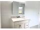 Bathroom vanity with granite countertops and a mirrored medicine cabinet at 13100 S Mccall Rd # 125, Port Charlotte, FL 33981