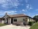 Charming condo featuring a stucco exterior, well-maintained landscaping, and neutral tones at 13100 S Mccall Rd # 125, Port Charlotte, FL 33981