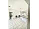 Open living area with tile floors, natural lighting, and high ceilings at 13100 S Mccall Rd # 125, Port Charlotte, FL 33981