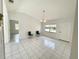 Spacious living room with tile flooring, neutral walls, and lots of natural light at 13100 S Mccall Rd # 125, Port Charlotte, FL 33981