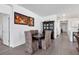 Elegant dining room with stylish chairs, modern light fixtures, and decorative wall art at 15069 Anchorage Rd, Punta Gorda, FL 33982