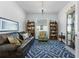 Cozy living room with unique decor, a comfortable couch, and a bright window at 15069 Anchorage Rd, Punta Gorda, FL 33982